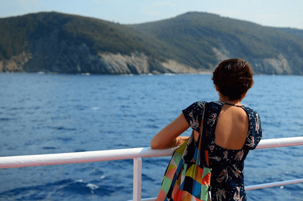 Lady on Boat by Island