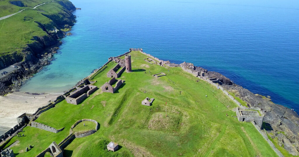 Isle of Man castle on green peninsula